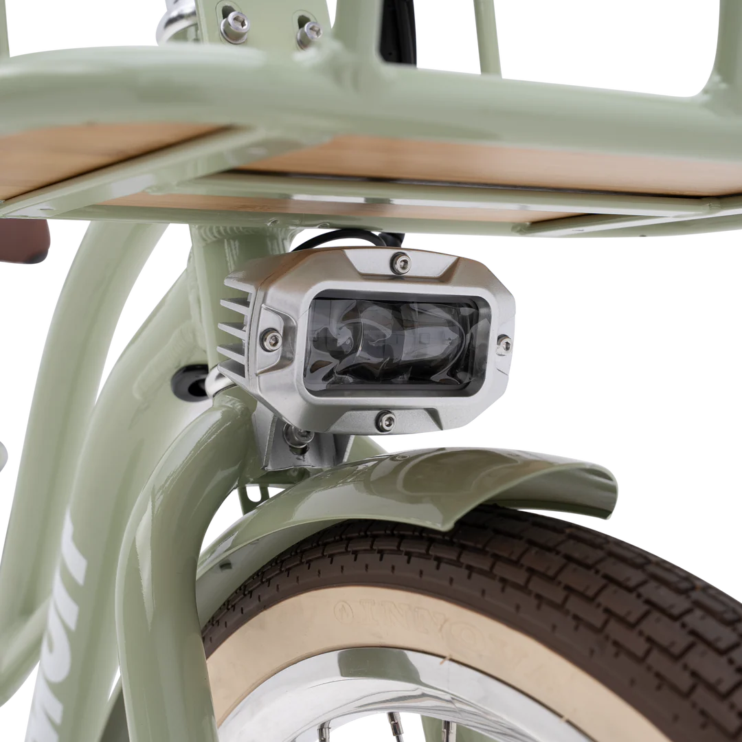 Side view of the Murf Gigi 2.0 eBike in white, showcasing its step-through frame, wide tires, and rear cargo rack against a plain background.