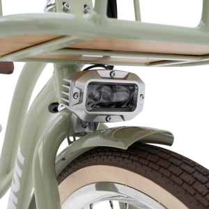 Side view of the Murf Gigi 2.0 eBike in white, showcasing its step-through frame, wide tires, and rear cargo rack against a plain background.