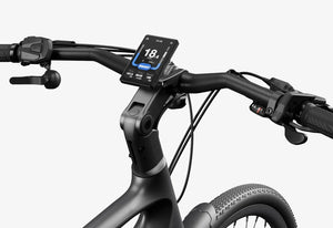 Side view of the Urtopia Carbon Classic eBike in black, showcasing its lightweight carbon fiber frame, sleek design, and integrated display on the handlebars.