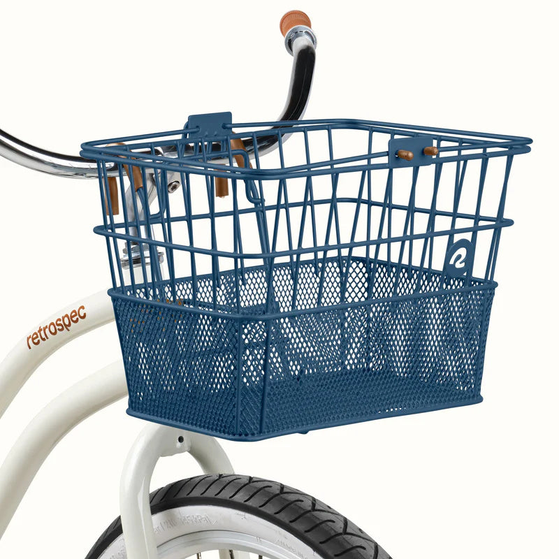 Navy blue Retrospec Apollo steel eBike basket attached to a bicycle, shown from a side angle.
