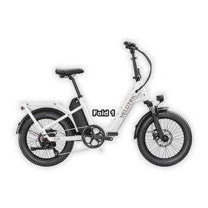 Velotric Fold 1 eBike in pearl white, folded and placed inside its box, product image on a white background