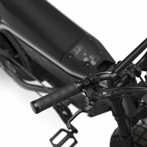 Side view of the eMOTO eBike Super73 MZFT in a showroom, highlighting its rugged frame, thick tires, and minimalist design.
