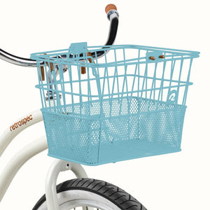 Retrospec Apollo steel bike basket in cool mint color attached to an eBike