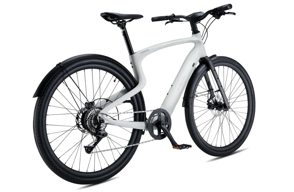 Side view of the Urtopia Carbon 1 Pro eBike in creme color, showcasing its lightweight carbon frame, integrated display, and sleek modern design against a plain background.
