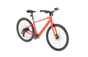 A sleek Velotric T1 ST Plus eBike in matte gray, shown from a side angle with a lightweight frame, integrated battery, and upright handlebars.
