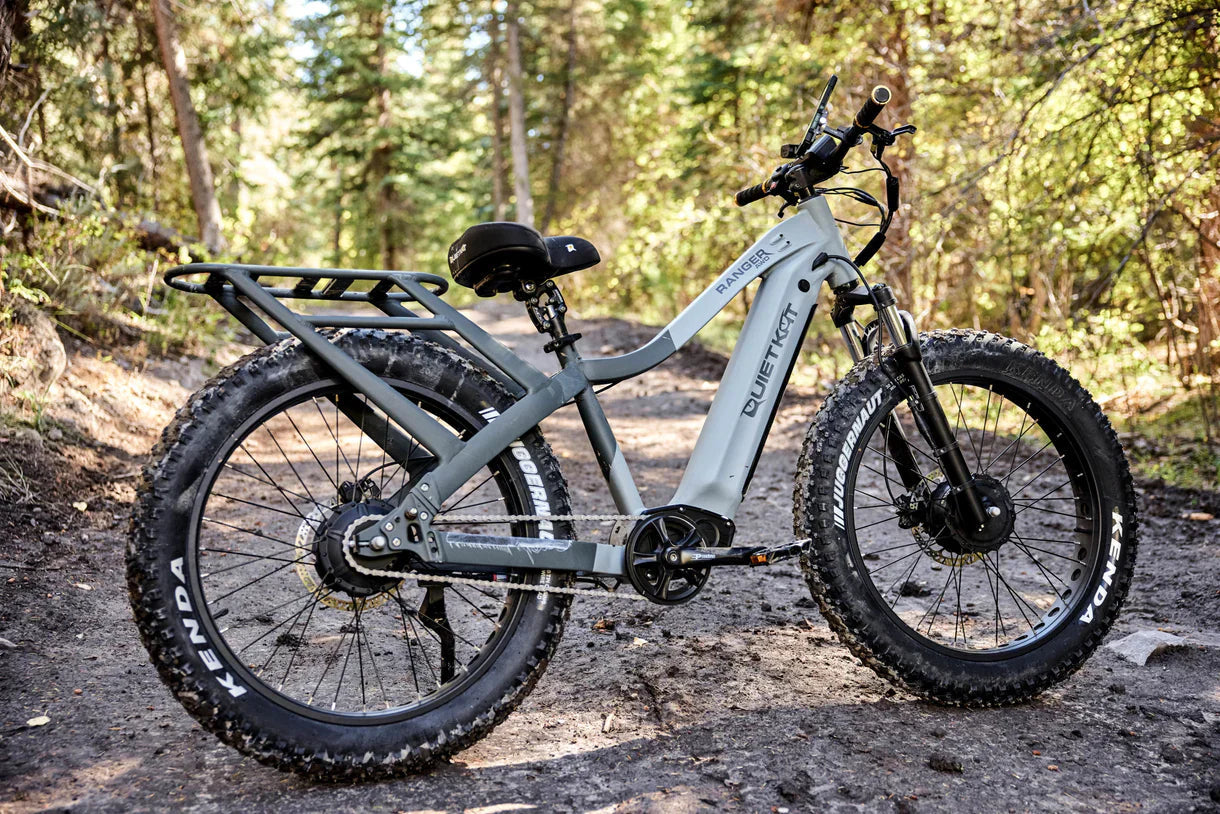 QuietKat Ranger AWD 750w Step Over eBike in black, featuring 26x4.5 inch fat tires, shown from a side angle against a white background.