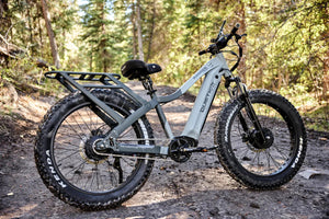 QuietKat Ranger AWD 750w Step Over eBike in black, featuring 26x4.5 inch fat tires, shown from a side angle against a white background.