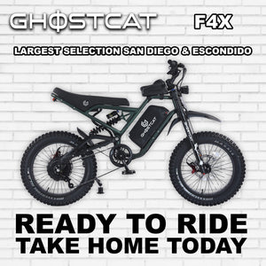 Army green eBike Ghostcat F4X, side view, rugged design, thick tires, outdoor background