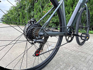 A black FREEGO E7 Step Over electric commuter bike with a 250W motor, upright handlebars, front suspension, and city tires, shown from the side against a white background.
