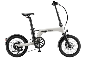 A cream-colored Urtopia Carbon Fold 2 eBike shown folded, highlighting its lightweight carbon frame and compact design.