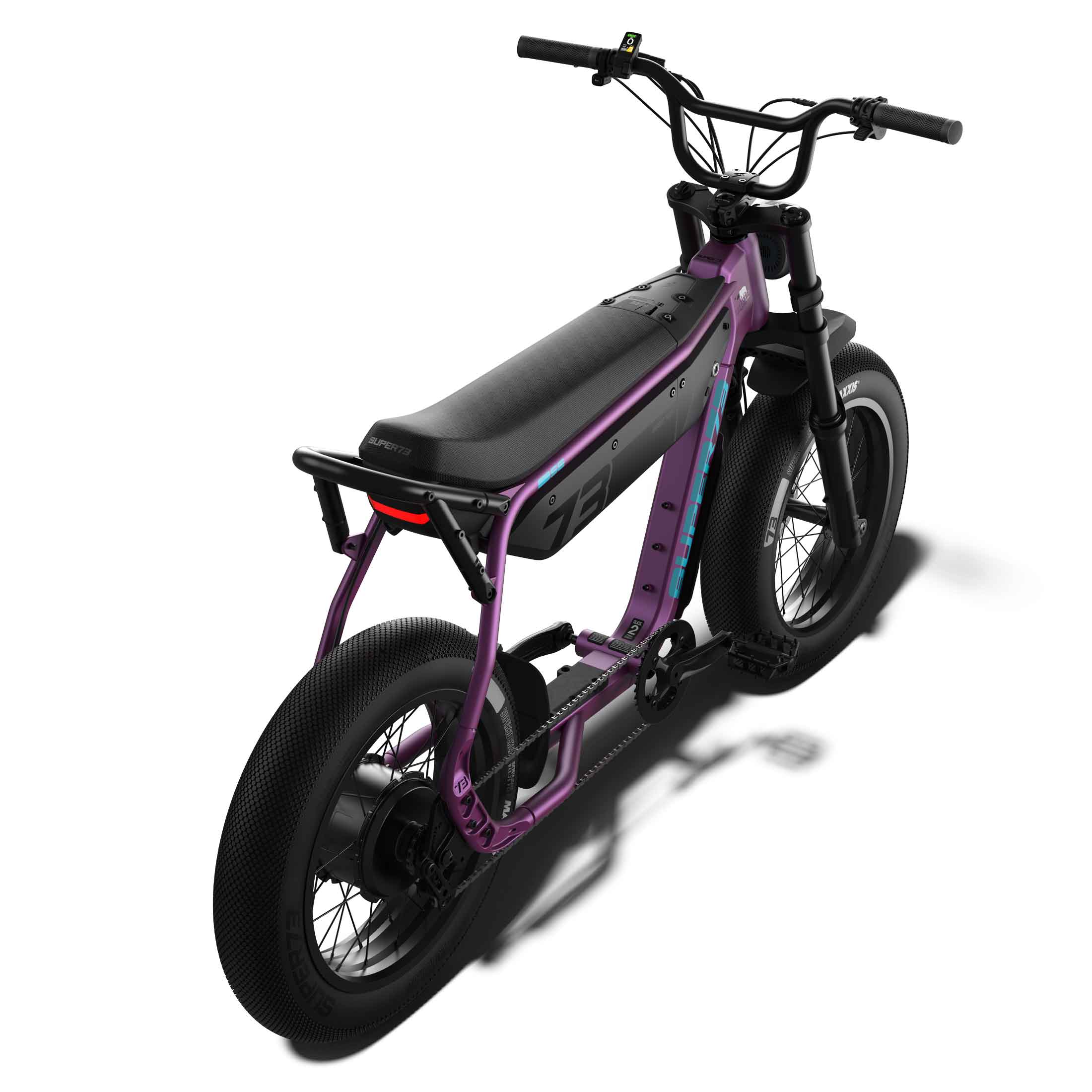 Side view of the eMOTO eBike Super73 B1G SE in a showroom, showcasing its black frame, thick tires, and minimalist design.
