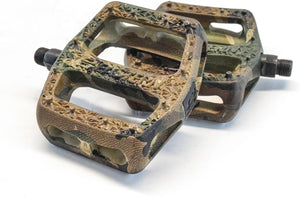 A pair of nylon bicycle pedals in a camouflage pattern, shown from a side angle.