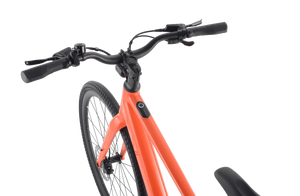 A sleek Velotric T1 ST Plus eBike in a modern urban setting, showcasing its lightweight frame, integrated battery, and minimalist design.