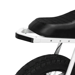 A black eMOTO eBike Strike Rhino electric bicycle shown from the side, featuring a sturdy frame, thick tires, and a rear cargo rack.
