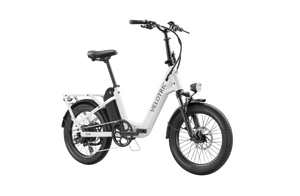 A compact, foldable Velotric Fold 1 eBike in matte black, shown fully assembled with its handlebars and frame folded for easy transport.