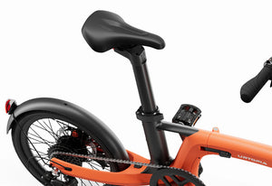 Orange Urtopia Carbon Fold 2 eBike side view, folded, showing compact design and lightweight carbon frame.