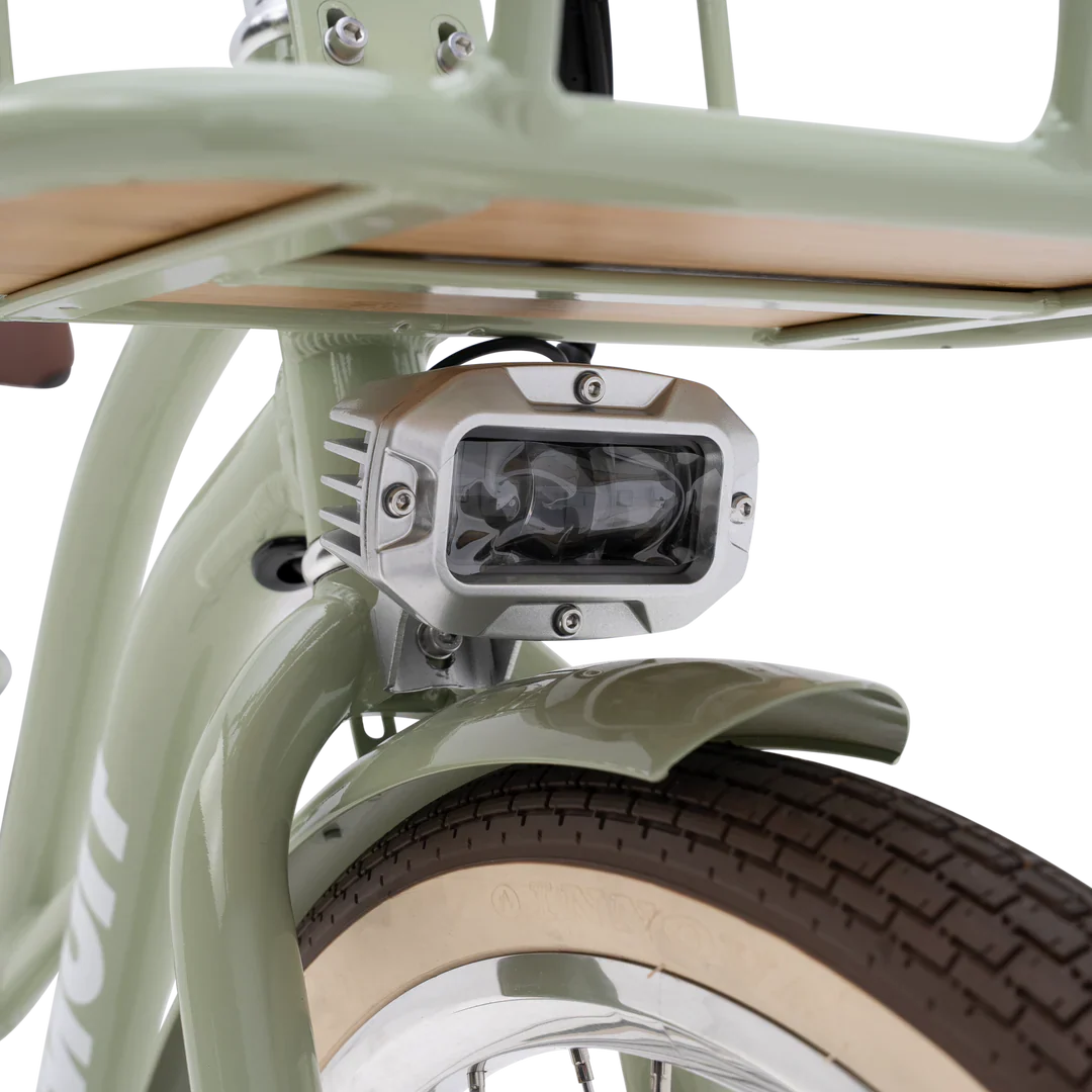 Side view of the eBike Murf Gigi 2.0 in a neutral setting, showcasing its step-through frame, wide tires, and modern design features.