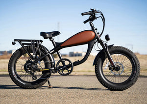 A vintage-style REVI Cheetah Mini 500w step-over electric bike with 20x4 fat tires, shown in a product image.
