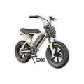 Macfox M16 X7 Mini eBike in desert beige color, shown inside its box with packaging materials.