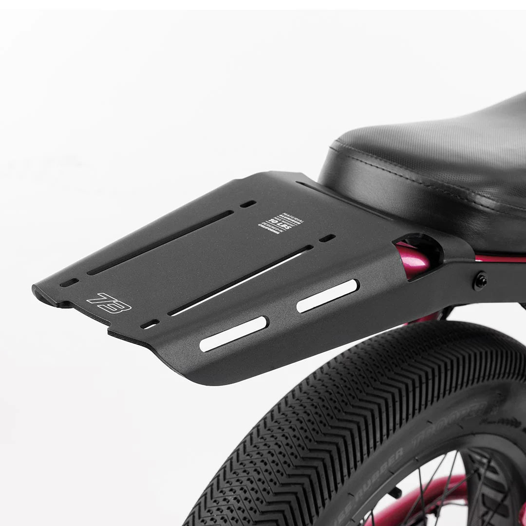 Rear view of a Super73 Z/ZX electric bike equipped with a black rear rack, showcasing the rack's design and mounting position above the back wheel.