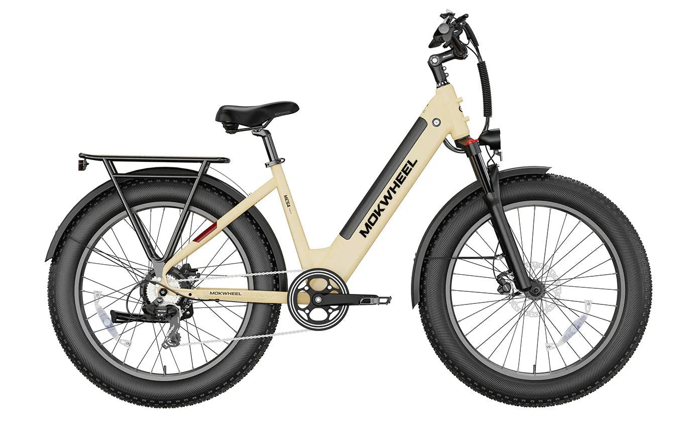 Tan MOKWHEEL Mesa Plus ST 750W step-thru electric bike with 26x4 fat tires, beach cruiser style, shown in product image.