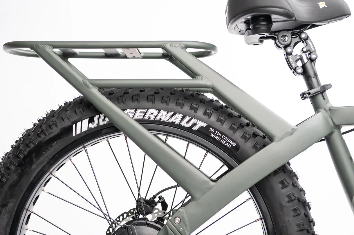 Side view of a QuietKat Ranger AWD 750w Step Over eBike with 26x4.5 fat tires, showcasing its rugged electric mountain bike design against a plain background.