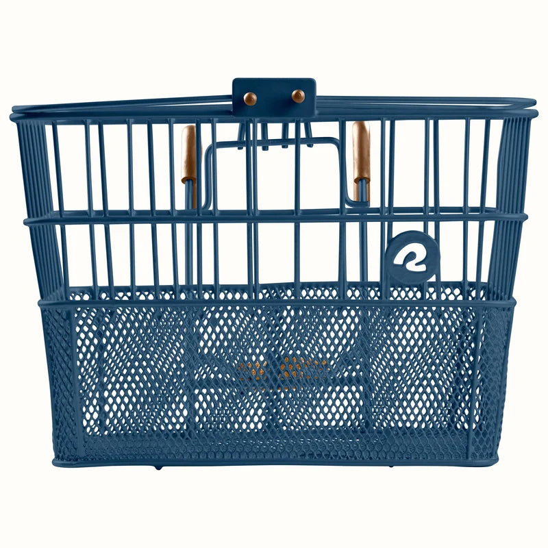 Navy blue Retrospec Apollo steel bike basket attached to the front of an eBike