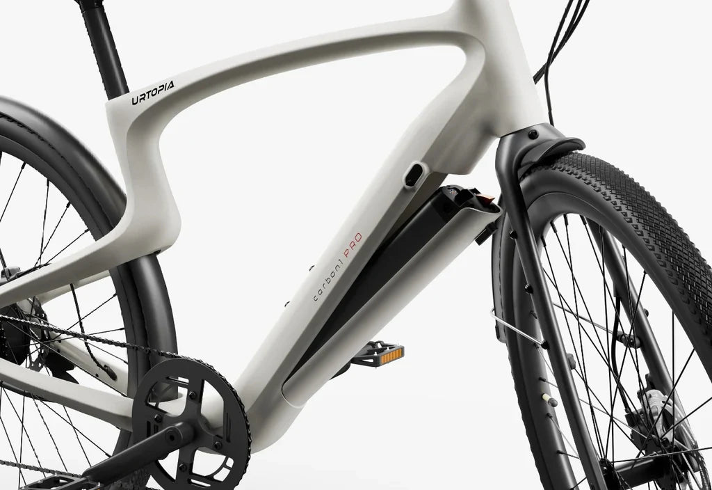 Side view of the Urtopia Carbon Classic eBike in black, showcasing its lightweight carbon fiber frame, sleek design, and integrated display on the handlebars.