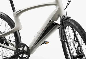 Side view of the Urtopia Carbon Classic eBike in black, showcasing its lightweight carbon fiber frame, sleek design, and integrated display on the handlebars.