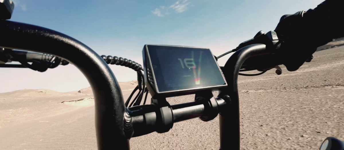 Engwe M20 3.0 electric bike in matte black, shown from a side angle, highlighting its dual battery setup, thick tires, front suspension fork, and LED headlight.