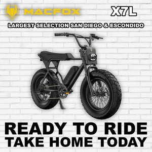 Black Macfox X7L eBike side view, showcasing sleek frame design and large tires, set against a plain background.