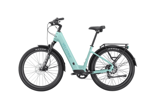 A Velotric Discover 2 electric bike in a side view, showcasing its step-through frame, integrated battery, upright handlebars, and rear cargo rack.