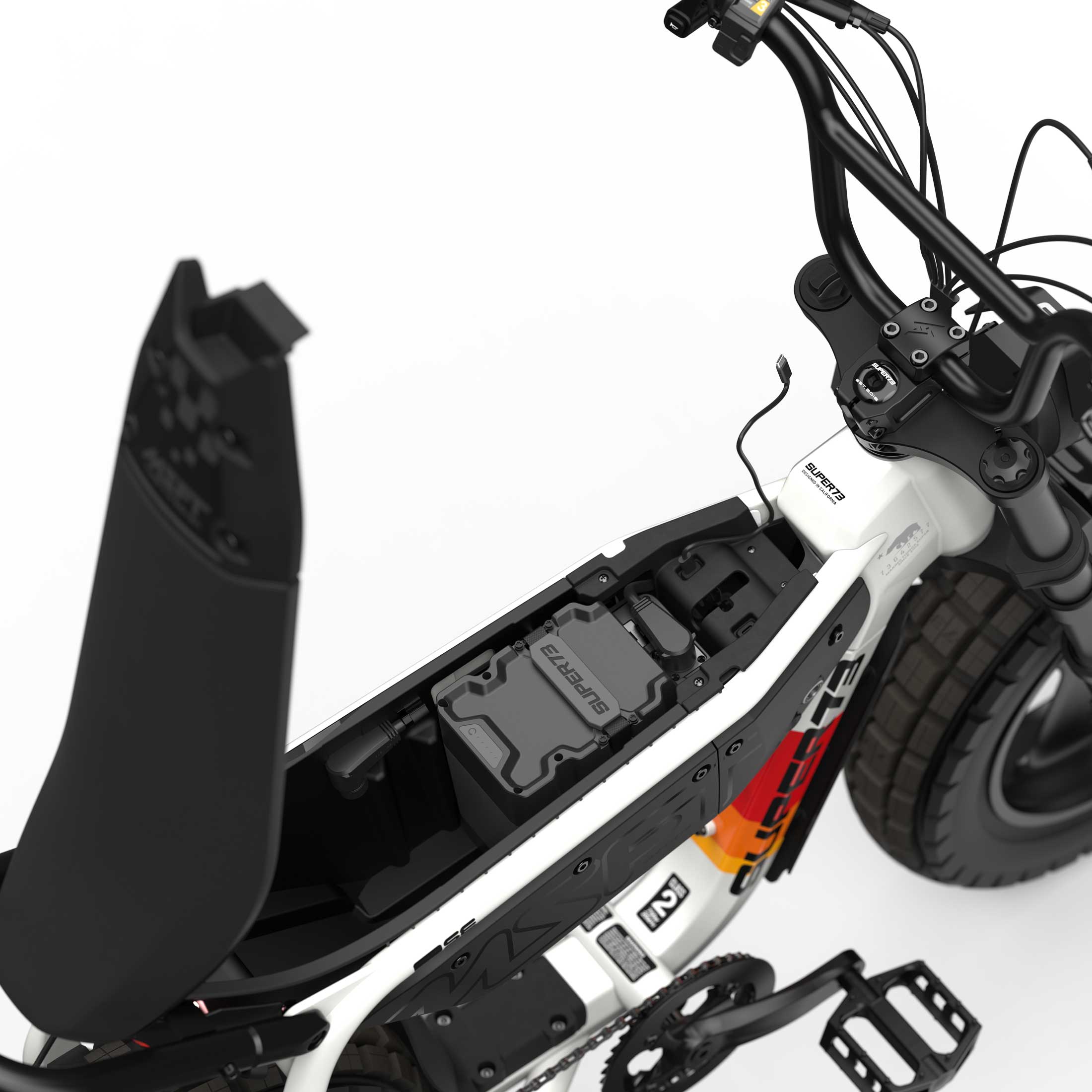 Super73 MZFT SE eMOTO eBike in Baja color, shown inside its original packaging box with included accessories