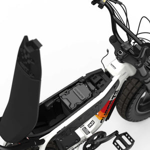 Super73 MZFT SE eMOTO eBike in Baja color, shown inside its original packaging box with included accessories