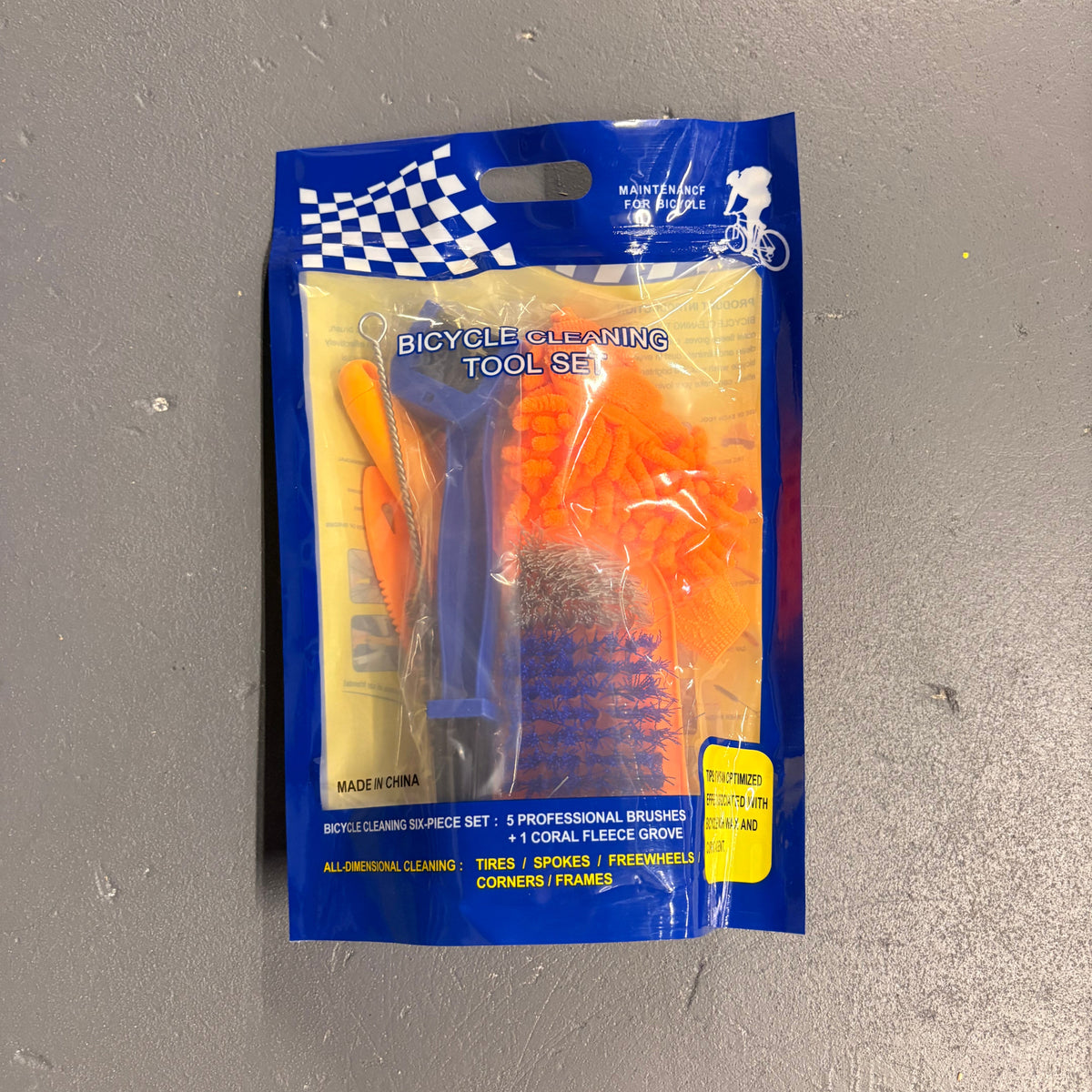Packaged bicycle tool set on a gray surface