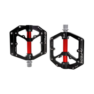 Black and red alloy eBike pedals with a textured surface and durable construction