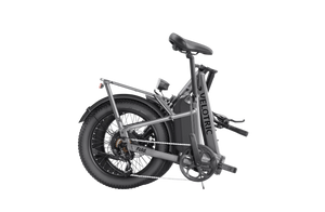 A compact, foldable Velotric Fold 1 eBike in matte black, shown fully assembled with its handlebars and frame folded for easy storage.