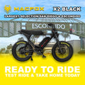 Black Macfox X2 eBike side view, showcasing rugged frame, thick tires, and modern design against a plain background.