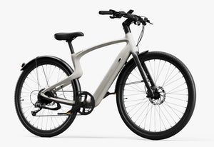 Side view of the Urtopia Carbon Classic eBike in creme color, showcasing its lightweight carbon frame, sleek design, and integrated components against a plain background.