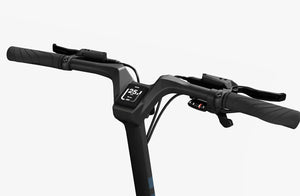 Side view of the Urtopia Carbon Fold 1 eBike in a folded position, showcasing its compact carbon fiber frame, black color, and modern design.