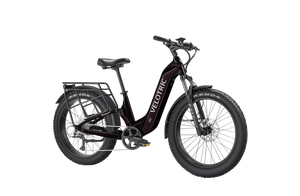 Side view of the Velotric Nomad 2X eBike in matte black, showing its fat tires, front suspension fork, integrated battery, and rear cargo rack.