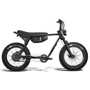 Side view of a black Super73 ZX SE electric bike with thick tires, minimalist frame, and a long seat, photographed against a plain white background.