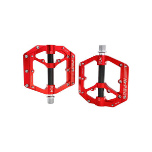 Red and black alloy eBike pedals with a sleek, modern design, shown on a black background.