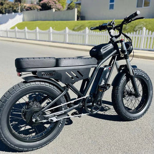Green eMOTO FREEGO Shotgun Lite F0 electric mini fat tire e-bike with moto style, 500W motor, side view on white background