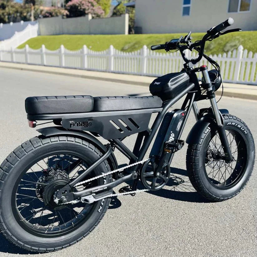 Green eMOTO FREEGO Shotgun Lite F0 electric mini fat tire e-bike with moto style, 500W motor, side view on white background