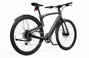 Side view of the Urtopia Carbon 1 Pro eBike in matte black, showcasing its lightweight carbon fiber frame, integrated display, and sleek, minimalist design.