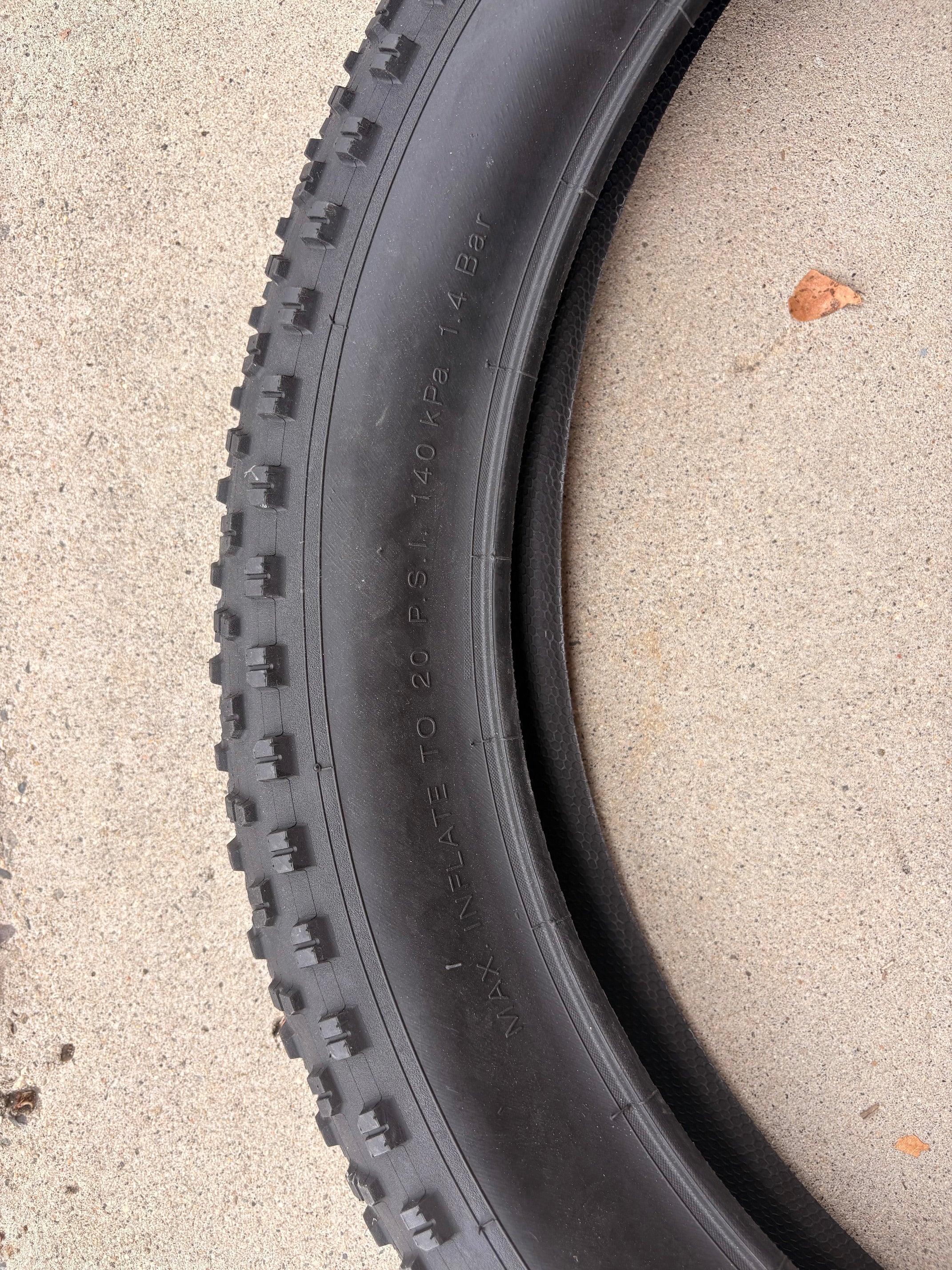 A black 26x4 Chao Yang fat tire mounted on an eBike wheel, showcasing the tread pattern and sidewall branding.
