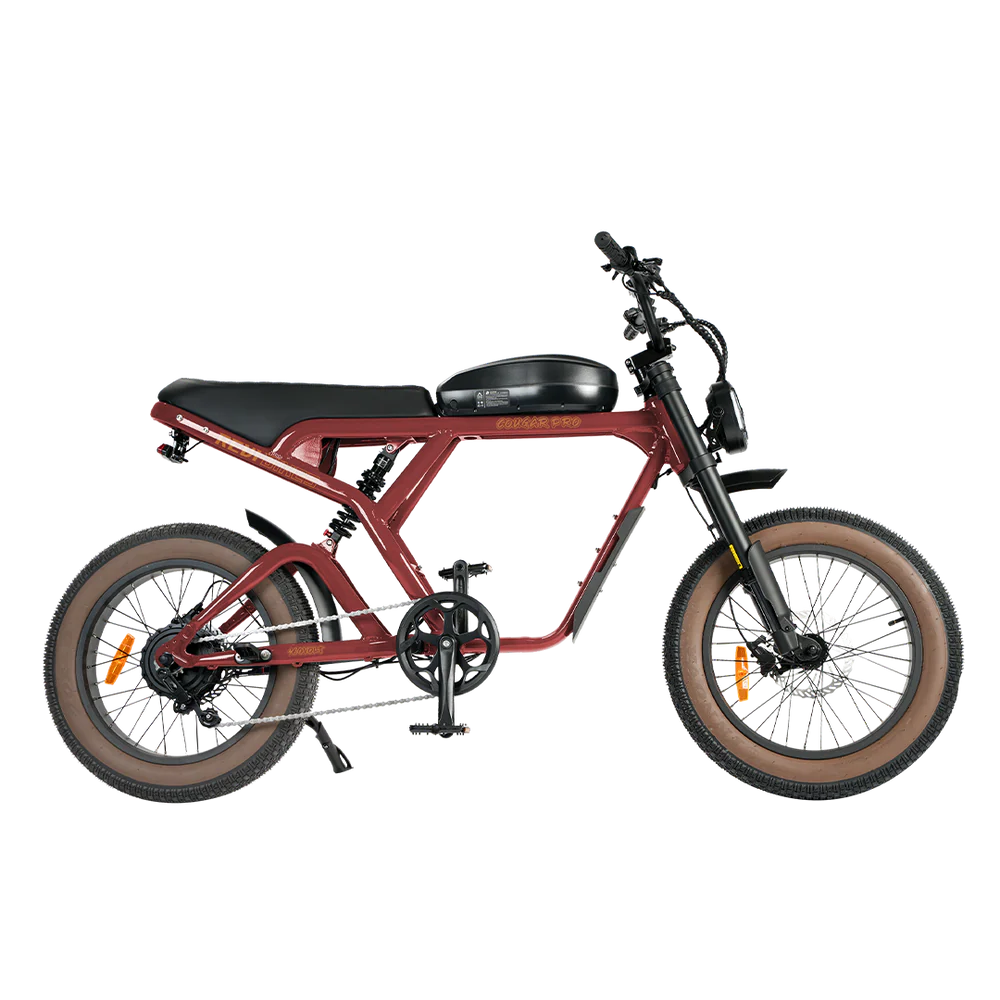 Red eBike Revi Cougar electric bicycle side view with black accents and thick tires