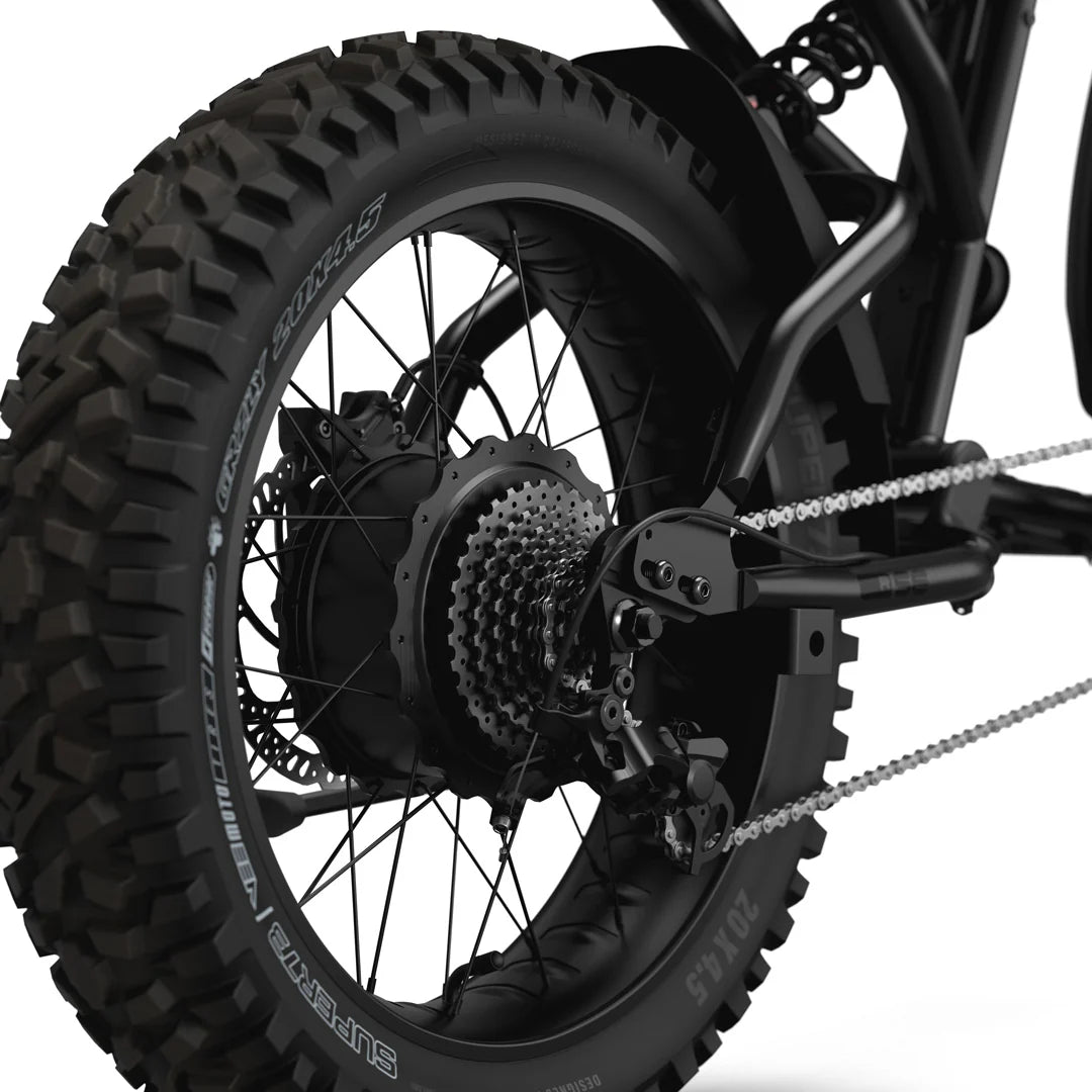 Side view of the Super73 R Adventure Series SE electric bike in a rugged outdoor setting, showcasing its thick tires, sturdy frame, and adventure-ready design.