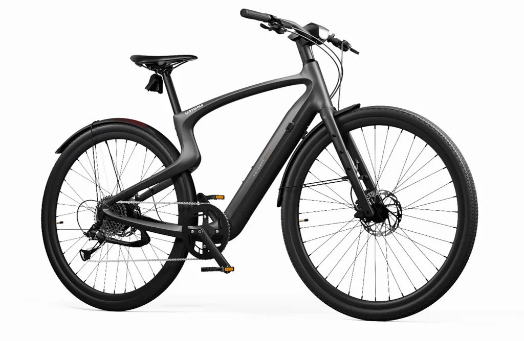 Side view of the Urtopia Carbon 1 Pro eBike in matte black, showcasing its sleek carbon fiber frame, integrated display, and minimalist design against a plain background.